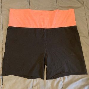 Black shorts with a pink waist band